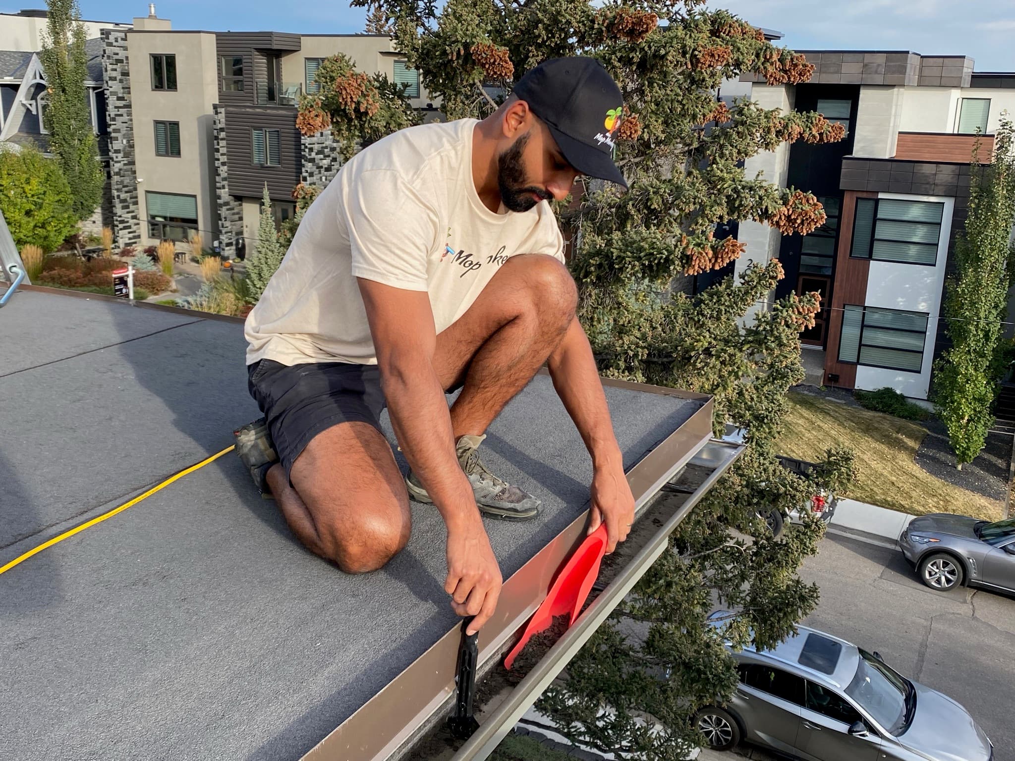 Gutter cleaning Calgary — technician clearing debris