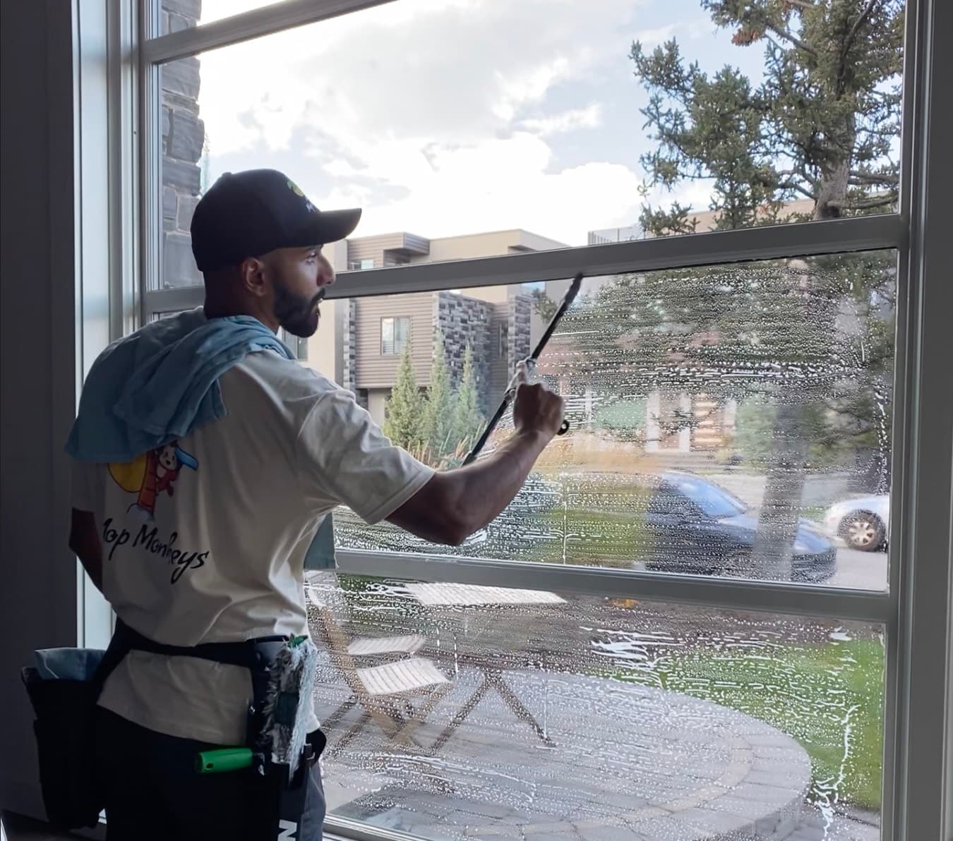 Window cleaning Calgary — technician with squeegee